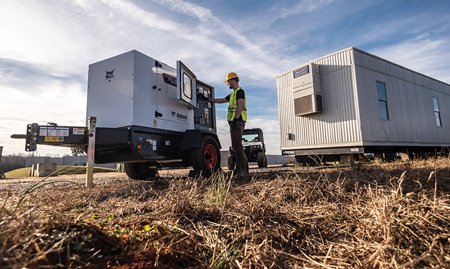 An Operator Adjusts Settings on a Bobcat Portable Generator for Roland Machinery Company in Franksville, WI 