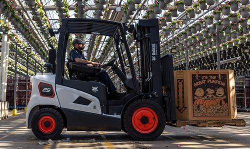 A Bobcat Forklift Carries a Pallet of Pumpkins Through a Nursery at Southeast Handling Systems in High Point, NC