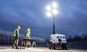 Workers Use a Bobcat Light Tower on a Dim Jobsite for Roland Machinery Company in Franksville, WI 